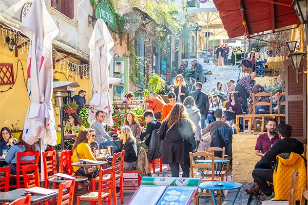 Race2Adventure Greece 2028 global vacation adventure bright daytime Athens market. Run, seek, adventure!