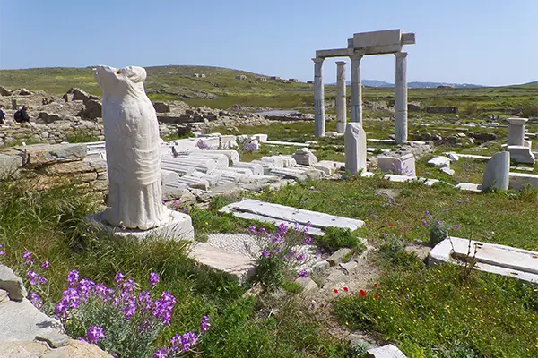 Race2Adventure Greece 2028 global vacation adventure ancient Greek ruins in a field on a sunny day. Run, seek, adventure!